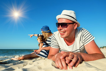 Wall Mural - the family is resting on the beach