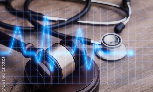 Fotomural Wooden gavel and stethoscope on background