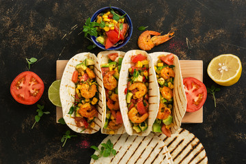 Wall Mural - MEXICAN FOOD. Homemade tacos with shrimps on a cutting board. View from above,overhead