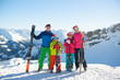 © oksanatrautwein - Happy family in Santa hats enjoying Christmas holidays in the mountains . Ski, Sun,Snow and fun.