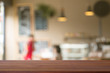 © taira42 - Wooden desk with Blurred of coffe's shop for abstract background