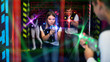© JackF - Girl playing laser tag in colorful beams
