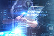 © Egor - The concept of business, technology, the Internet and the network. A young entrepreneur working on a virtual screen of the future and sees the inscription: Continuous improvement