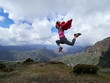 © bereta - young happy woman jumping on top of the mountain