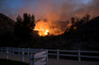 Fire Burning Hill Just Beyond White Park Fence in California Woolsey Brushfire
