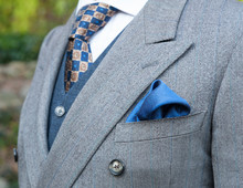 Unidentifiable Torso Of A Man In An Expensive Suit With Tie, Vest And Pocket Square.