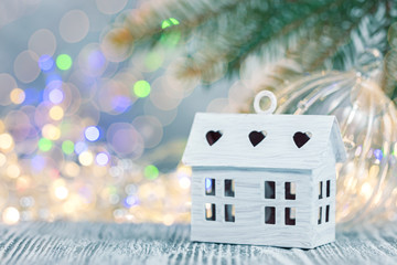 xmas holidays decorations on defocused winter background with lights and fir tree branch