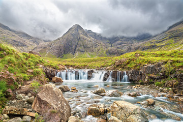 Wall Mural - View of waterfall on river Allt Coir a Mhadaidh at Fairy Pools in Glen Brittle, Isle of Skye, Scotland