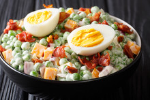 English Cuisine Pea Salad With Boiled Eggs, Onions, Bacon And Cheddar Cheese With Sauce Close-up In A Bowl. Horizontal