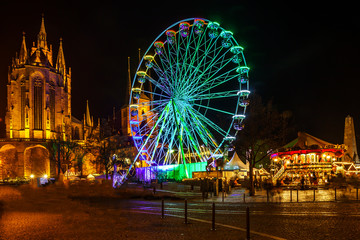 christmas market with carousel and cathedral in erfurt thuringia germany