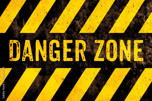 Cuadros en Lienzo Danger zone warning sign text with yellow and black stripes painted over concrete wall surface facade cement texture background