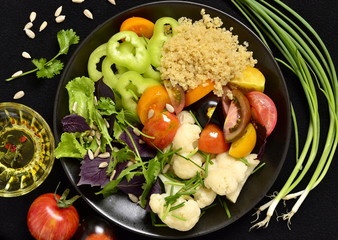 Wall Mural - Vegetarian salad with quinoa, vegetables and sunflower seeds. Buddha bowl, top view 