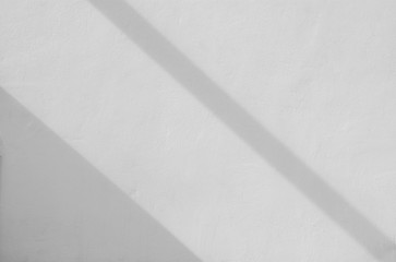 white concrete wall with shadow from window - background