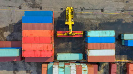 Container ship in export and import business and logistics. Shipping cargo to harbor by crane. Water transport International. Aerial view and top view.