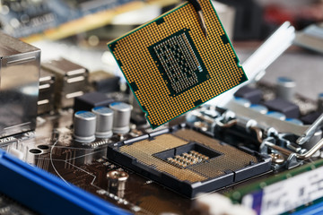 Electronic engineer of computer technology. Maintenance computer cpu hardware upgrade of motherboard component. Pc repair, technician and industry support.