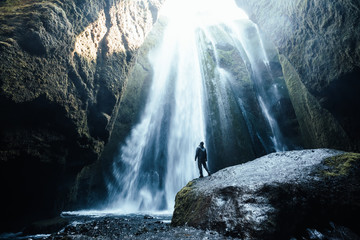 Perfect view of famous powerful Gljufrabui waterfall in sunlight.