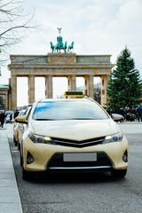 Wall Mural - Taxi car in street of Berlin