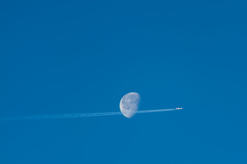the airplane with the moon on a blue background.