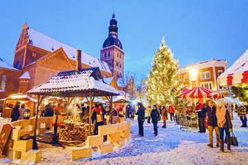 Wall Mural - People enjoy Christmas market Riga