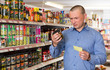 © JackF - man purchasing food products on shopping list