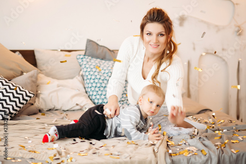 Close Up Of Positive Little Cute Boy With Beautiful Mom In Stylish