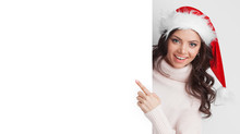 Girl In Christmas Hat Holding Poster