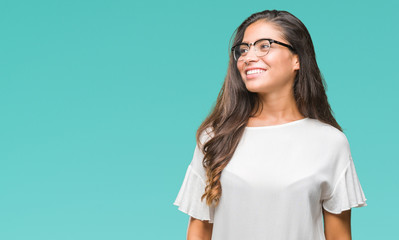 Sticker - Young beautiful arab woman wearing glasses over isolated background looking away to side with smile on face, natural expression. Laughing confident.