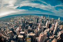 Fisheye Aerial View Looking Down At The Sprawling Metropolis Of Chicago Illinois With Lake Michigan In The Background