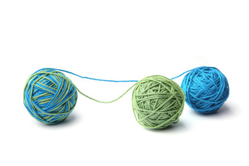 Colorful cotton thread ball from two color green and blue thread isolated on white background. Different color green and blue thread mix.