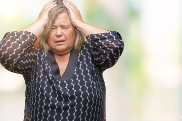 Sticker - Senior plus size caucasian woman over isolated background suffering from headache desperate and stressed because pain and migraine. Hands on head.