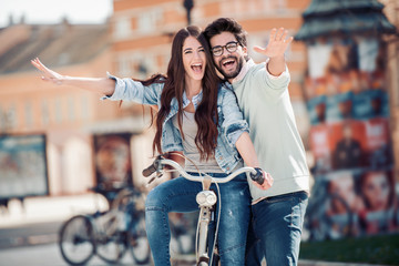 Wall Mural - Picture of romantic couple riding bike