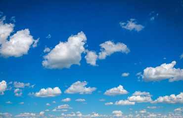 Blue sky with fluffy clouds as background