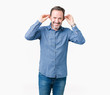 © Krakenimages.com - Handsome middle age elegant senior man over isolated background Smiling pulling ears with fingers, funny gesture. Audition problem