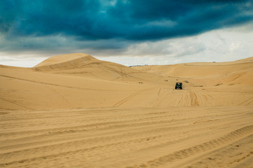  Jeep trail on the white sand dunes Mui Ne,Vietnam, Southeast Asia. Before raining