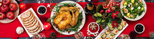 Baked Turkey. Christmas Dinner. The Christmas Table Is Served With A Turkey, Decorated With Bright Tinsel And Candles. Fried Chicken, Table.  Family Dinner. Top View