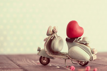 Miniature Vintage Blue Motorcycle Carrying Tiny Red Heart