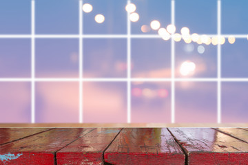 Canvas Print - wooden desk with blurred light bokeh abstract background