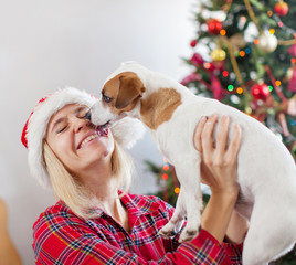 Sticker - Happy woman with dog in christmas decoration