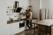  beautiful loving couple kissing in the kitchen