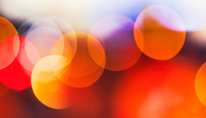 Wall Mural - christmas concept: festive background with light spots and bokeh in front of a empty wooden table