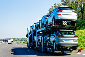 Canvas Print - Cars carrier truck on asphalt road in Poland