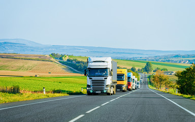 Canvas Print - Trucks in asphalt road in Poland