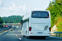 White Tourist Bus In Road In Poland