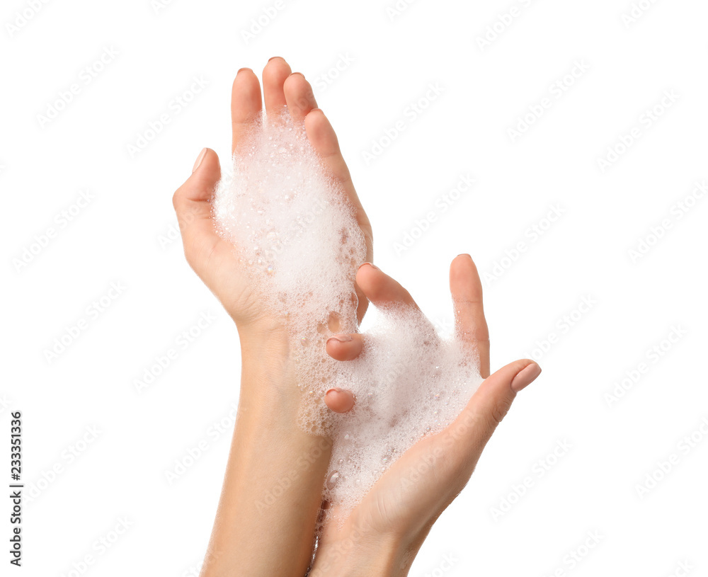Female hands with soap foam on white background