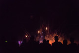 Fototapeta Dmuchawce - Crowd watching fireworks and celebrating new year eve