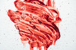 top view of blood smeared with hand on white