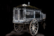 Old and dusty wooden hearse carriage from the 19th century