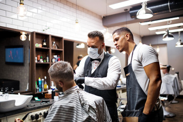 Wall Mural - Hipster man client visiting haidresser and hairstylist in barber shop, training concept.