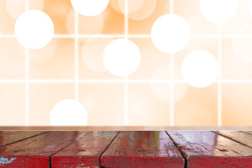 Wall Mural - Wooden desk with Gradient Abstract Blurred orange tone lights background