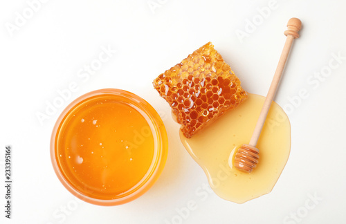 Photographie Composition with fresh honey on white background, top view